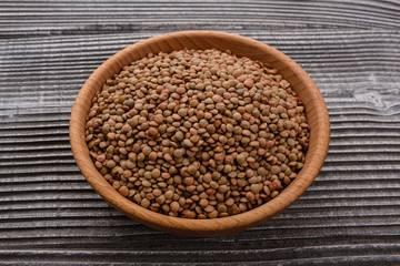 raw lentils on a wooden rustic background