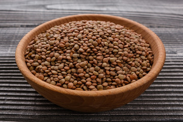 raw lentils on a wooden rustic background