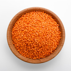 raw lentils on a white acrylic background