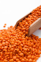 raw lentils on a white acrylic background