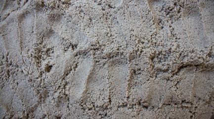 the grey sand scattered on the table