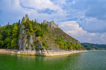 Fototapeta na wymiar Scenic view of Czorsztyn Castle and artificial Czorsztynskie Lake in Southern Poland