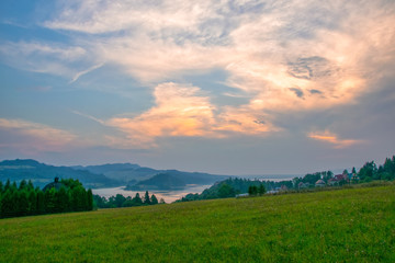 Obraz premium Rural landscape near artificial Czorsztynskie Lake in Southern Poland at sunset