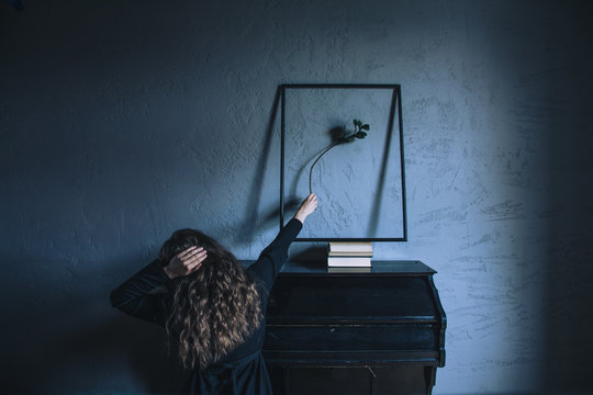 woman with plant and a harmonium