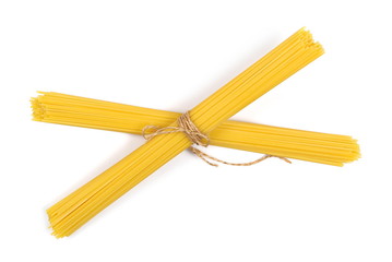 Spaghetti, yellow pasta isolated on white background, top view