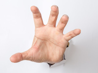 Male hand  punching through the paper - obrazy, fototapety, plakaty