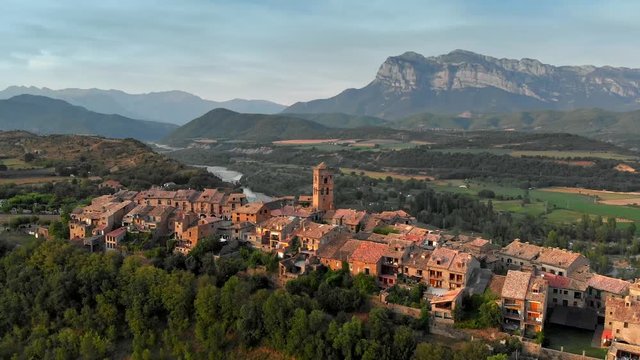Aerial sunset view of Ainsa - mountain village in Aragon mountains, Spain. 4K, UHD