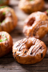Fresh doughnuts on wooden table
