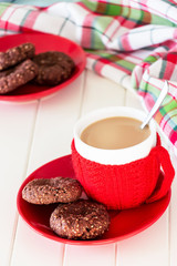 Oats cookies with chocolate spread and cup coffee. Christmas concept. White wooden background. Selective focus.