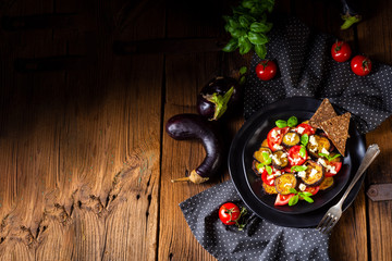 Eggplant grilled with aromatic feta cheese and tomatoes