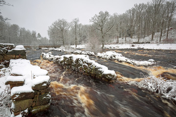 Wild Morrum river in snowy winter, Sweden