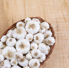 Pile of Fresh Organic Garlic on Vintage Wooden Background