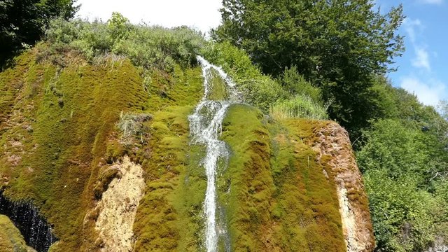 Travertine waterfall Dreinmuehlen (engl. three mills) at Nohn in  Vulkan Eifel region (Germany)