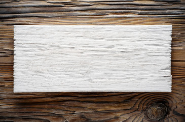 white painted signboard on darl wood