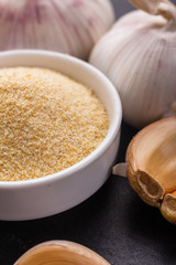 fragrant garlic on a dark stone background