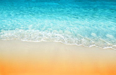 tropical sand beach and sea wave background