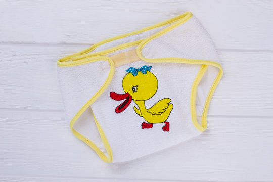 Baby cotton underpants with cartoon duck image, close up.