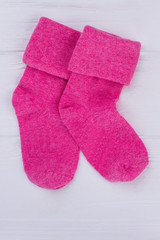 Colourful pink baby wool socks.