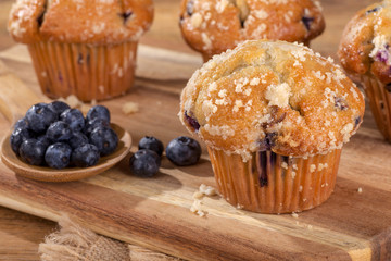 Blueberry Muffin With Berries on a Wooden Board