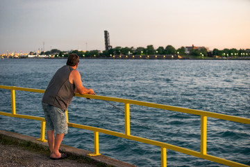 Fishing off the pier at sunset