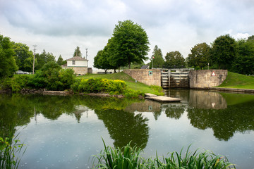 Fototapeta na wymiar Reflecting pond below canal lock