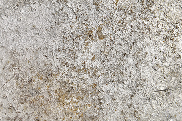Faded metal surface, dyed with silvery paint.