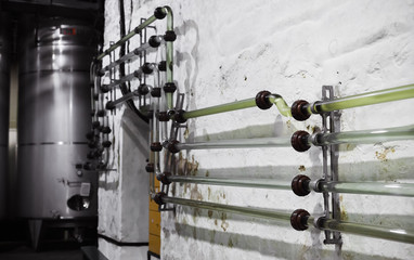 Glass tubes for pumping wine at the winery