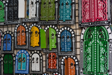 Stained glass window (gates) as a mirror - traditional souvenir of Tunisia