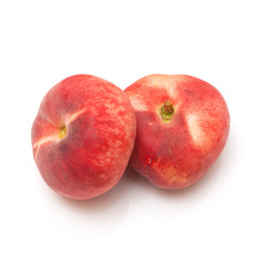 Flat peaches isolated on a white studio background.