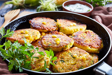 fried corn fritters in a skillet