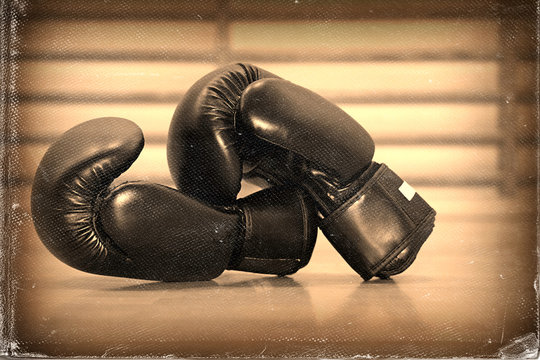 Boxing gloves . Vintage style,  old worn paper photo effect image
