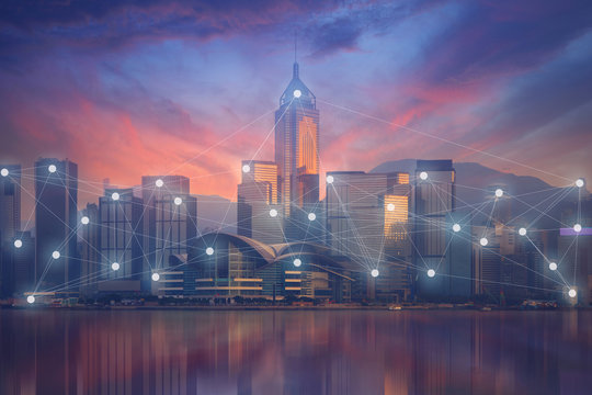 Business and technology concept on modern city skyline on beautiful sunset sky prime time with busy connection activities.