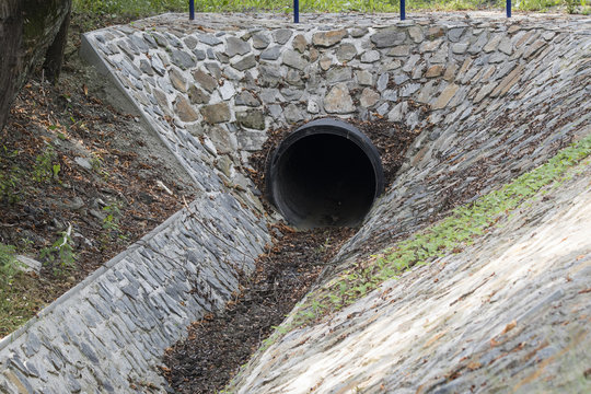 Trough the pipe.