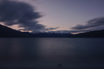Scenic View Of Lake Against Snowcapped Andes Mountains