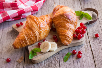 Delicious croissant with fruit for breakfast