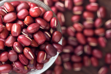 red bean in glass cups on wooden table background