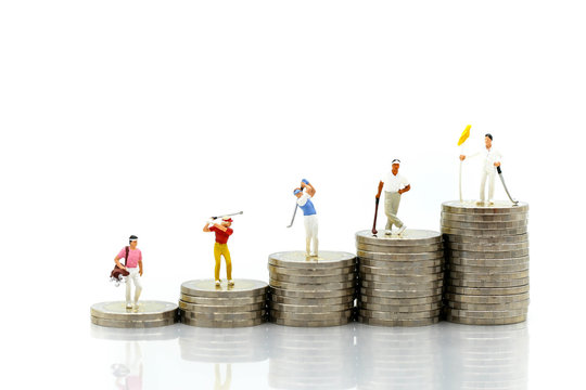 Miniature people : Golfer teams playing stand with stack of coins , sport and business concept. - Powered by Adobe