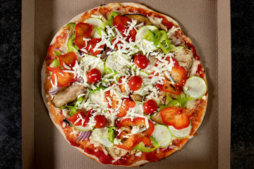 Vegetarian pizza in the packing box