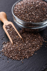 chia seeds on a dark stone background
