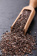 chia seeds on a dark stone background