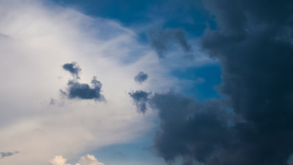 Dark blue stormy cloudy sky natural background. Clouds 