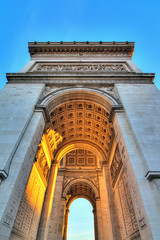Beautiful view of the Arc de Triomphe at sunset in Paris, France