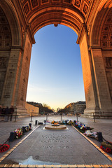 Beautiful view from under the Arc de Triomphe in Paris, France, with the tomb of the unknown...