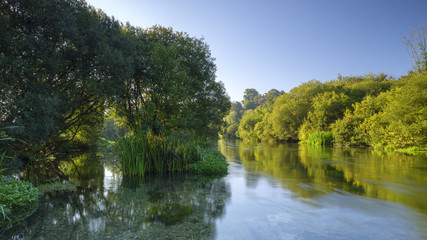 Autumn sunrise on the River Itchen - a famous chalk bed stream renowned for fly fishing - between Ovington and Itchen Abbas in Hampshire, UK.