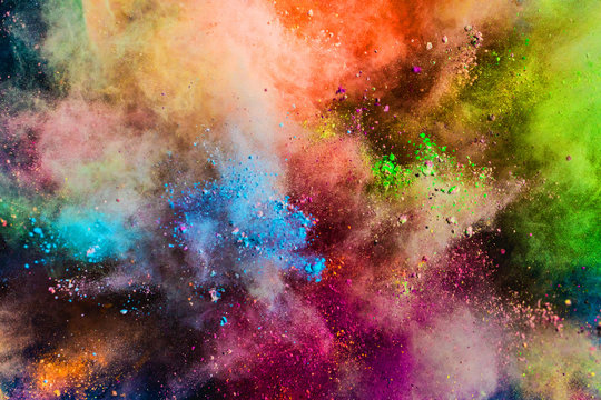 Colorful powder splashing in the air.