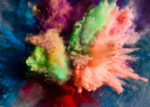 Holi powder splashing in the air.