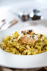 tasty pasta with salmon on a the table