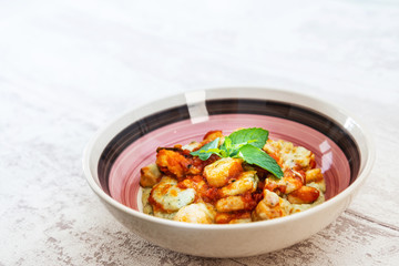 Dish made with cooked duck meat, dehydrated potato, fresh cream of mushroom and cheese