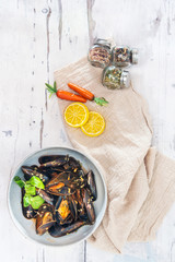 Mussel with white wine sauce on table