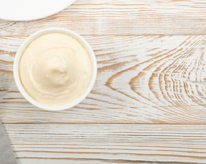 Olive Mayonnaise or Mayo Sauce in Small White Bowl Close Up